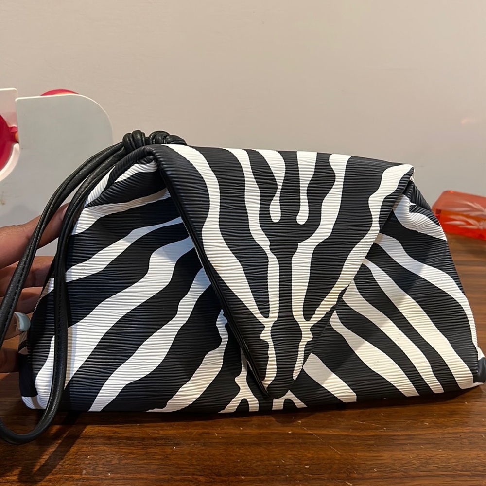 Got Zebra print clutch!